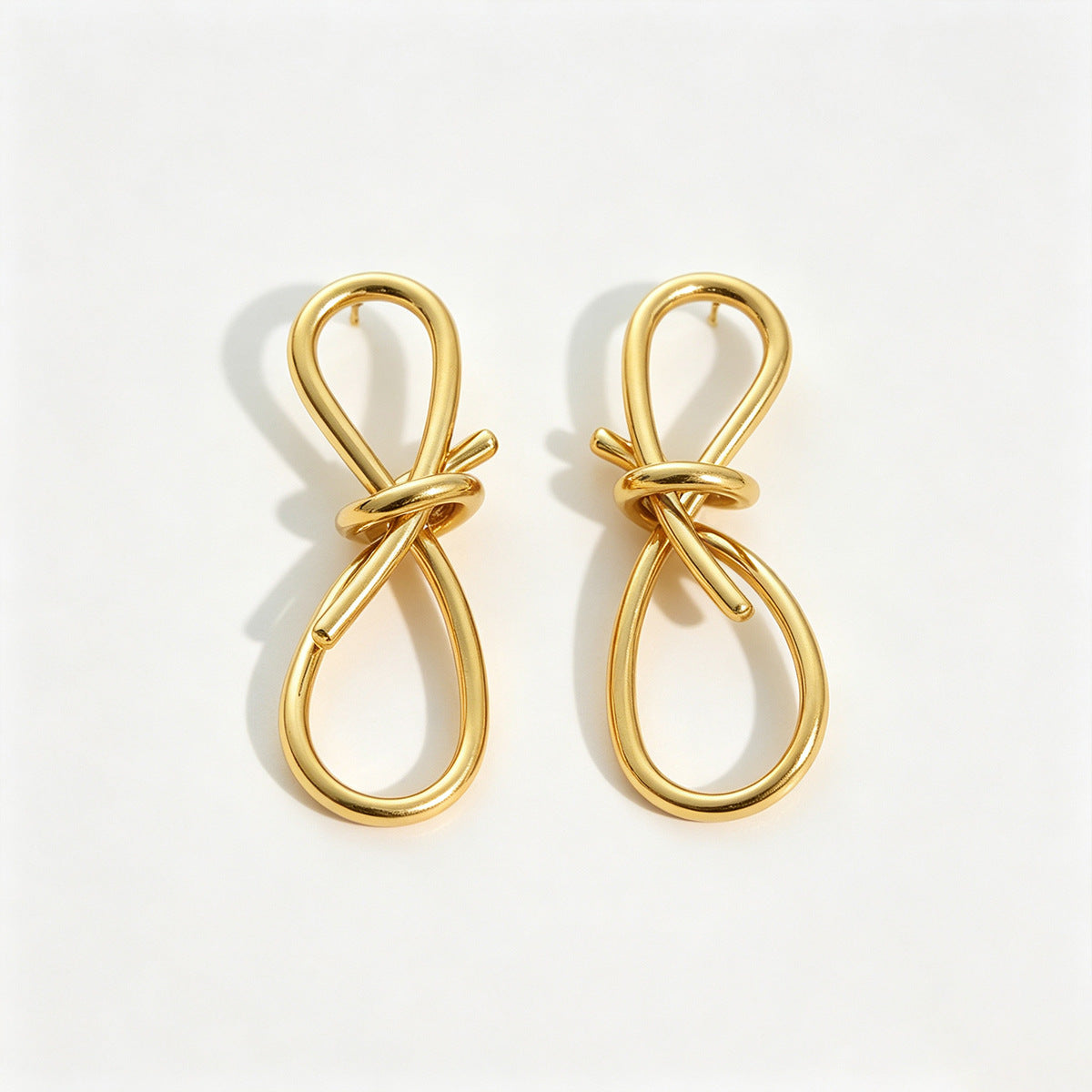 Boucles d'oreilles nœud en fil doré
