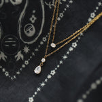 Collier double rang doré — petit zircon et goutte suspendue