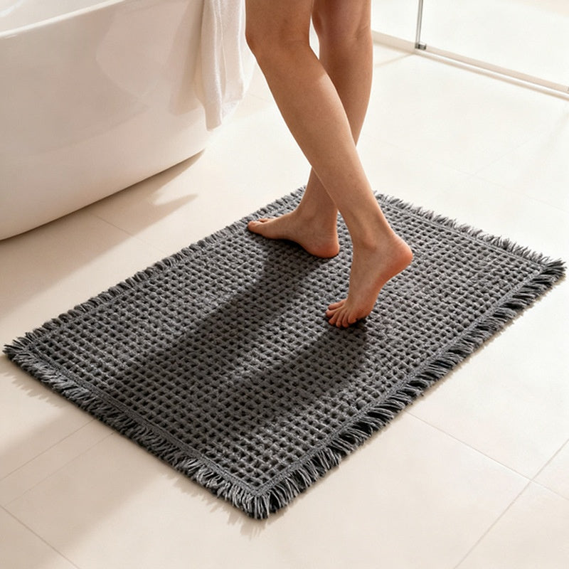 Tapis de bain gaufré à franges — polyester doux