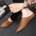 Mules homme aspect cuir lisse — bout rond, se chaussent sans les mains