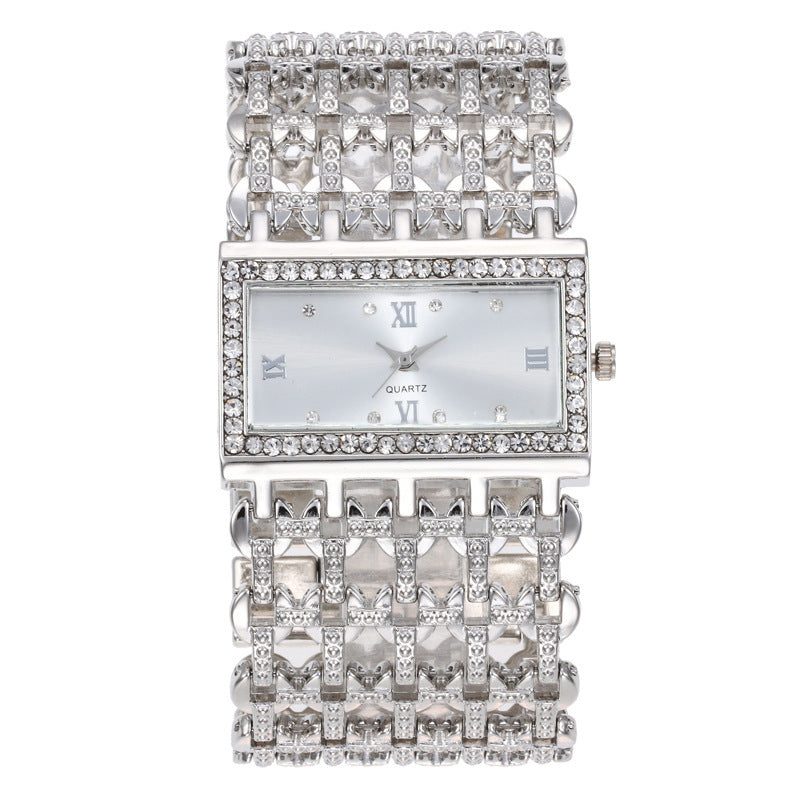 Reloj de mujer rectangular con strass y brazalete ancho calado