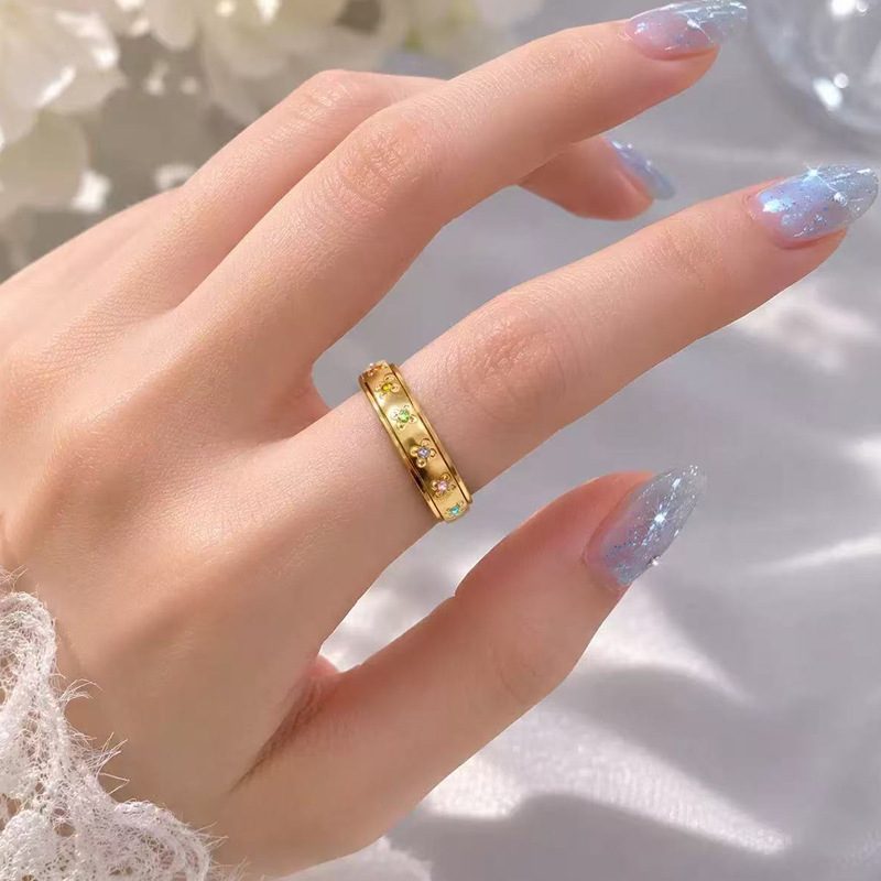 Bague à anneau tournant en acier inoxydable — fleurs serties de pierres de couleur