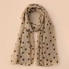 Pois sur fond beige