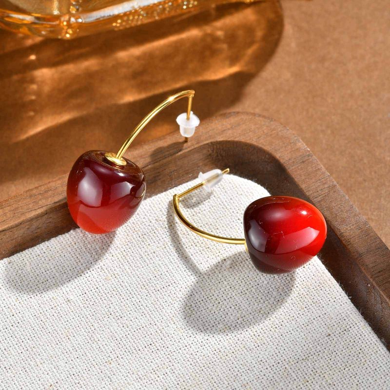 Puces d’oreilles cerise rouge en acier inoxydable