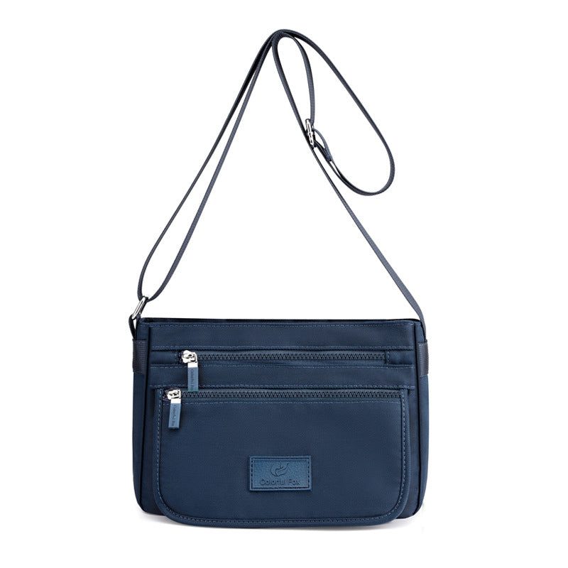Women’s structured handbag — short handle and shoulder strap — colour