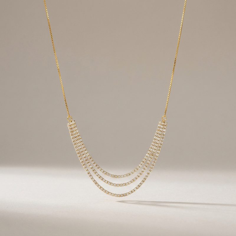 Collier rivière triple rang serti de zircons — doré