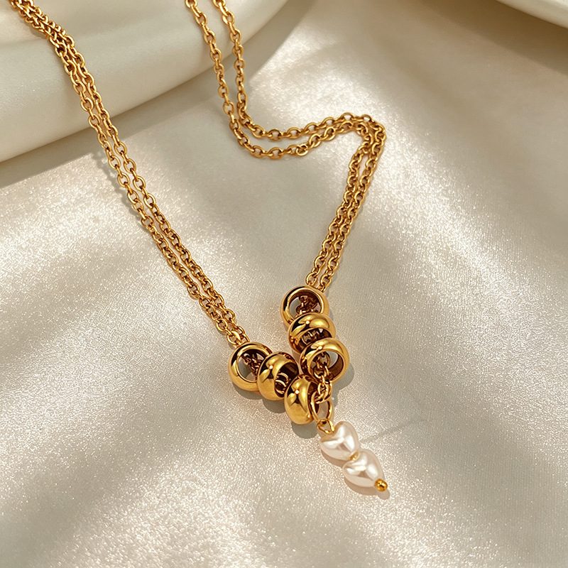 Collier doré à anneaux bombés et perles — double chaîne, acier inoxydable