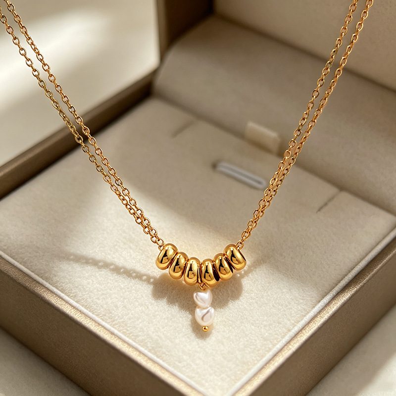 Collier doré à anneaux bombés et perles — double chaîne, acier inoxydable