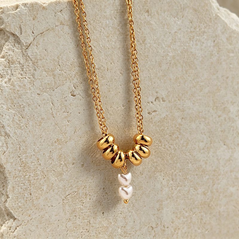 Collier doré à anneaux bombés et perles — double chaîne, acier inoxydable
