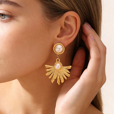 Boucles d’oreilles pendantes soleil — acier doré