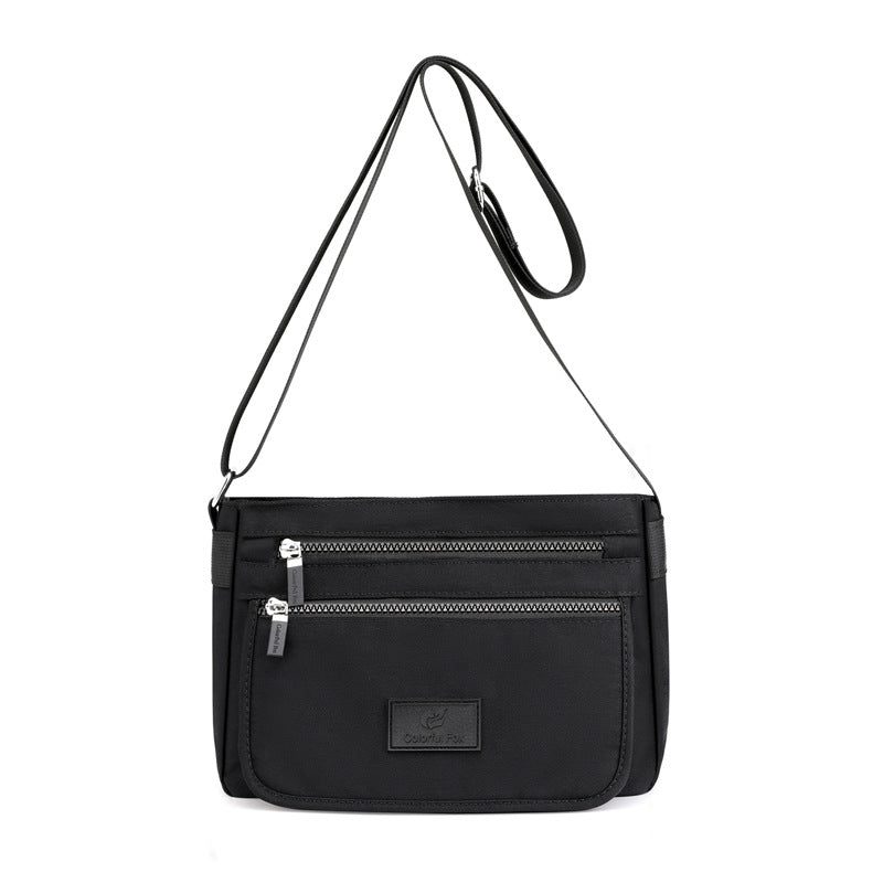 Women’s structured handbag — short handle and shoulder strap — colour